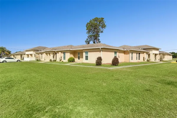 a view of a house with a big yard