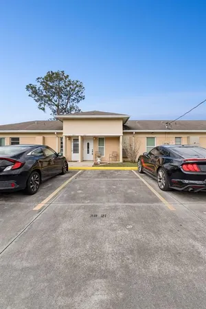 a view of a car parked in front of a building