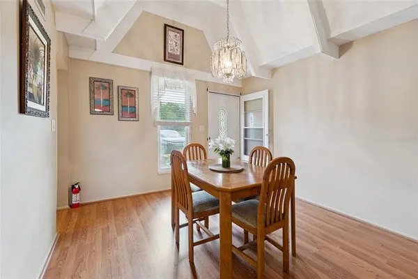 a view of a dining room with furniture and wooden floor
