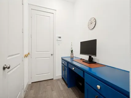 a view of workspace with a flat screen tv