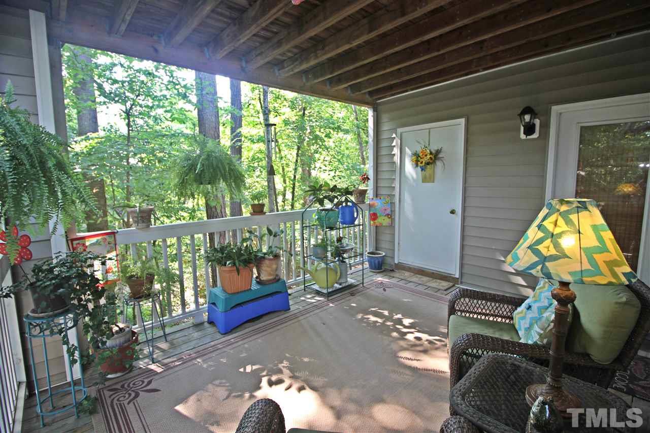 921 Springfork Drive Cary, NC 27513 - Photo 20 of 22 a living room filled with furniture and a potted plant