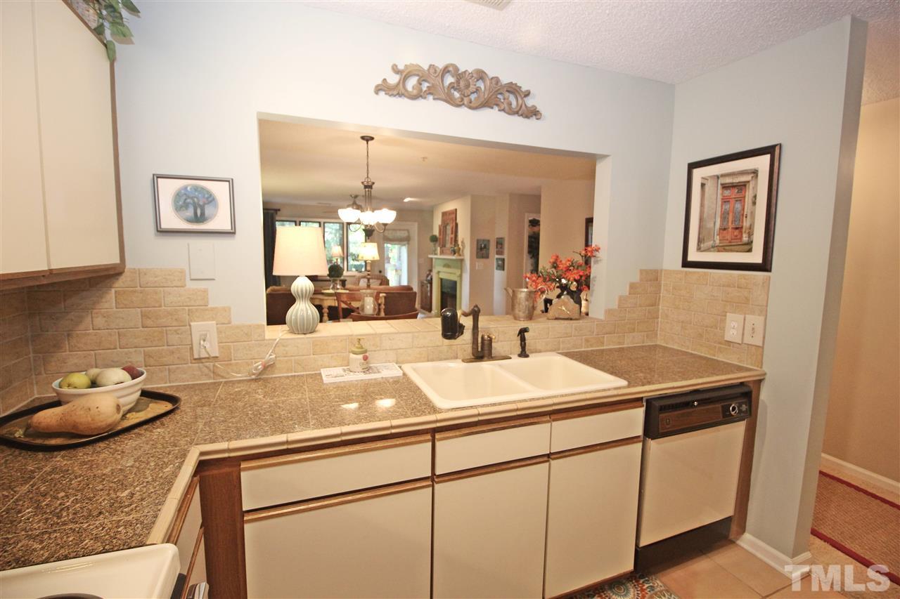 921 Springfork Drive Cary, NC 27513 - Photo 5 of 22 a bathroom with a sink and a mirror