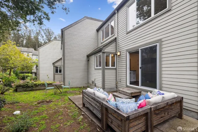 a view of a house with a yard and plants