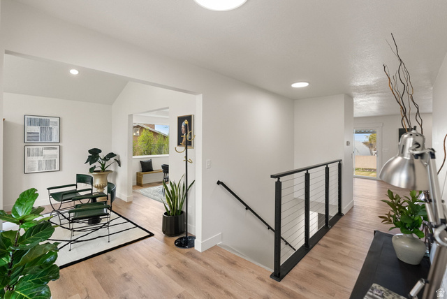 368 Spring Creek Road Providence, UT 84332 - Photo 19 of 45 Hall featuring an upstairs landing, light wood-style flooring, recessed lighting, and vaulted ceiling