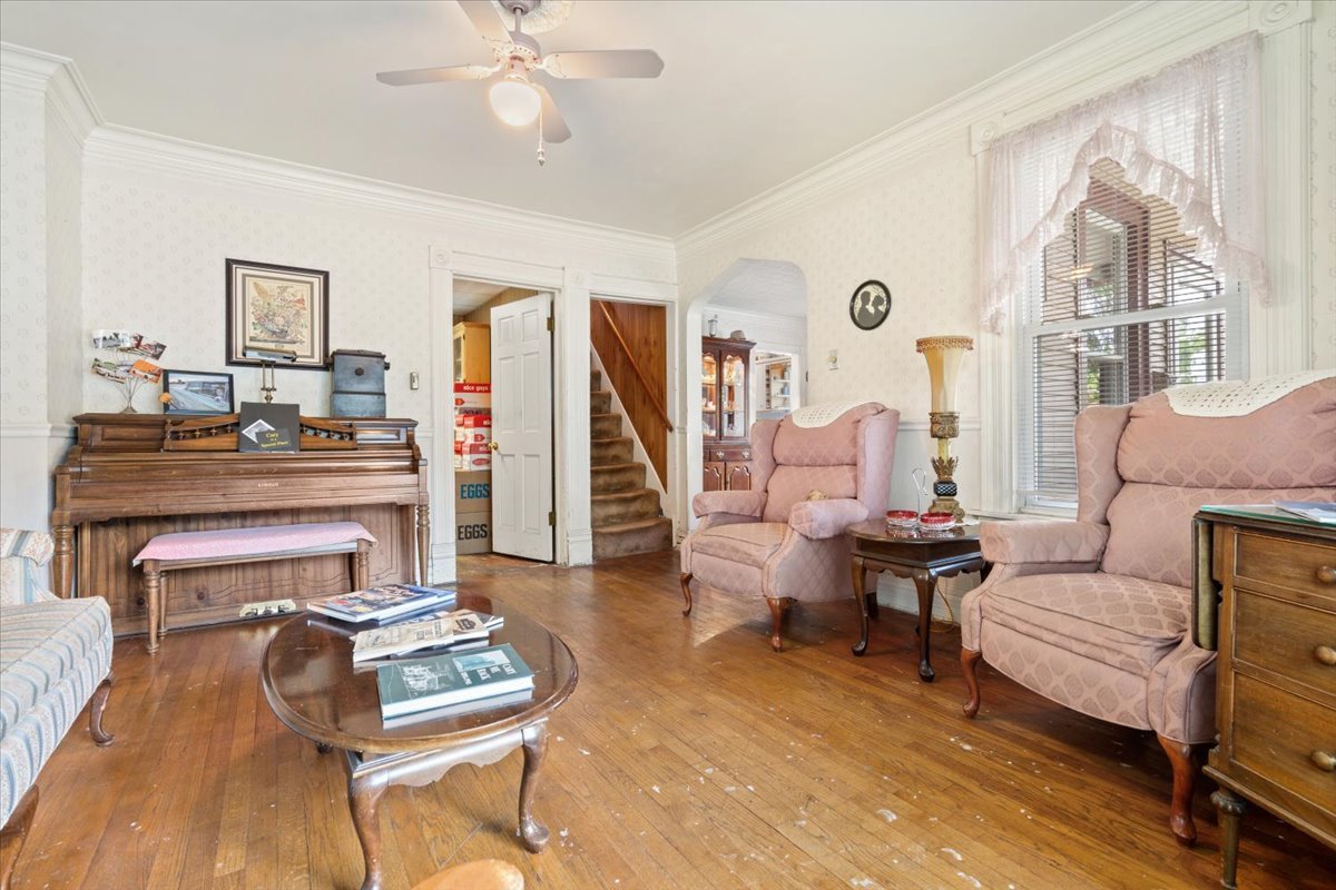 116 Spring Street Cary, IL 60013 - Photo 11 of 45 a living room with furniture and a wooden floor