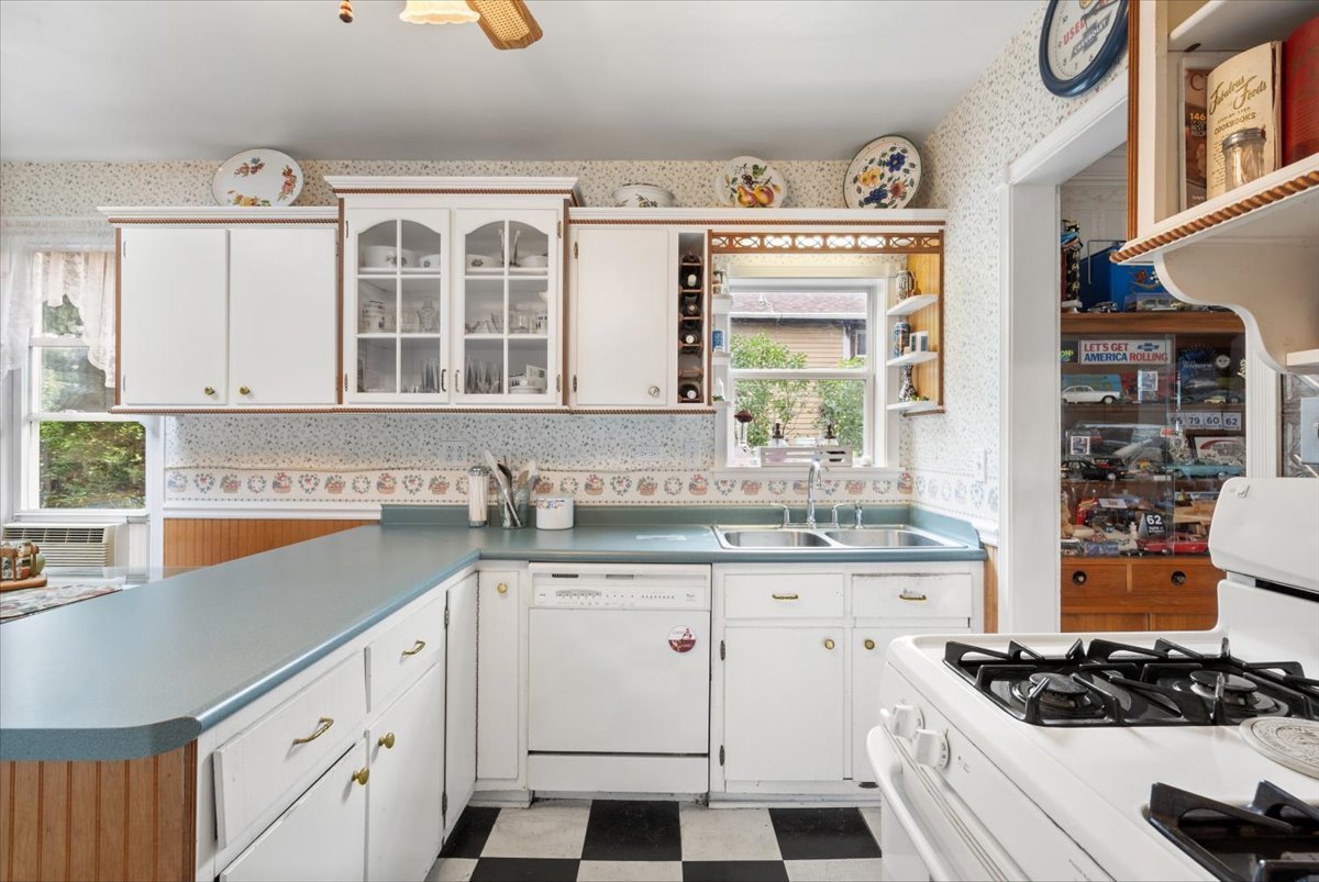 116 Spring Street Cary, IL 60013 - Photo 13 of 45 a kitchen with cabinets appliances and a window