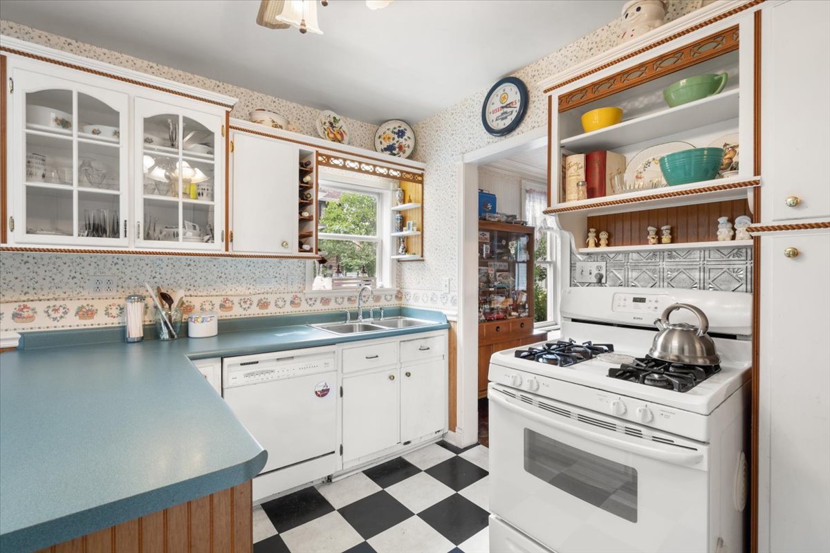 116 Spring Street Cary, IL 60013 - Photo 14 of 45 a kitchen with stainless steel appliances granite countertop a stove and a sink