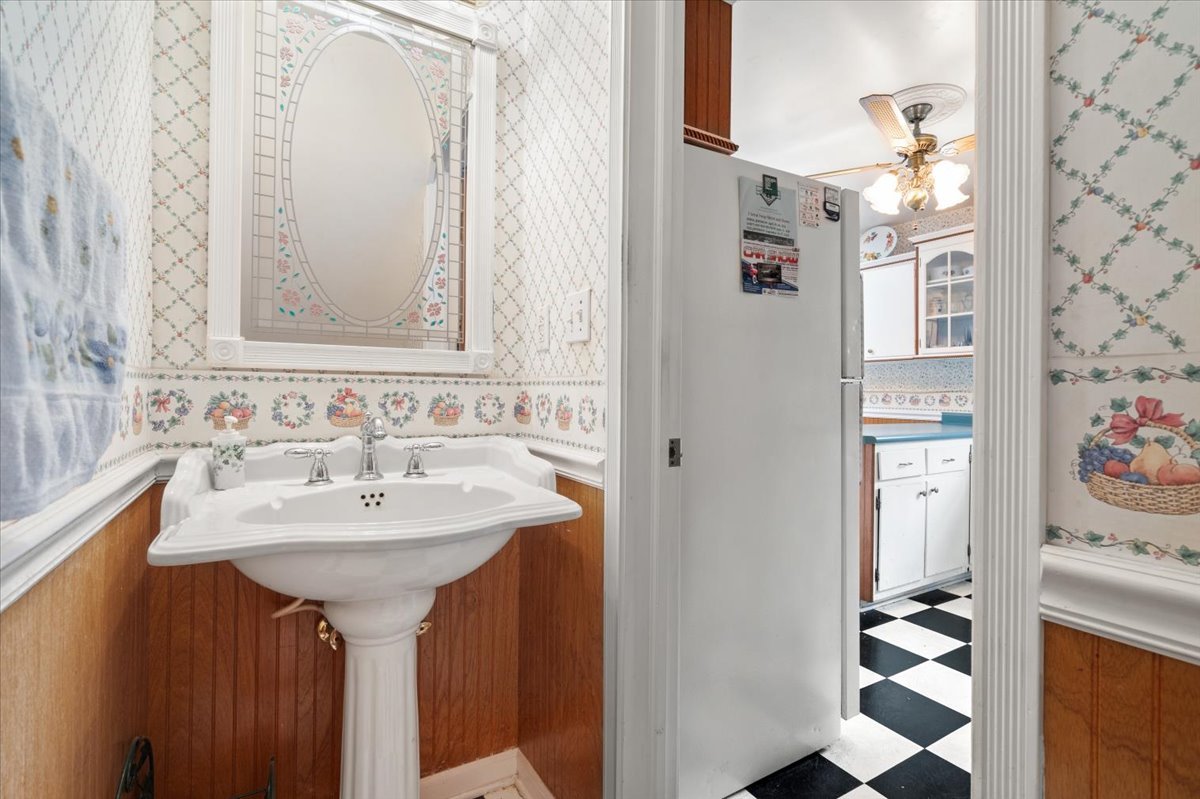 116 Spring Street Cary, IL 60013 - Photo 18 of 45 a bathroom with a sink and a mirror
