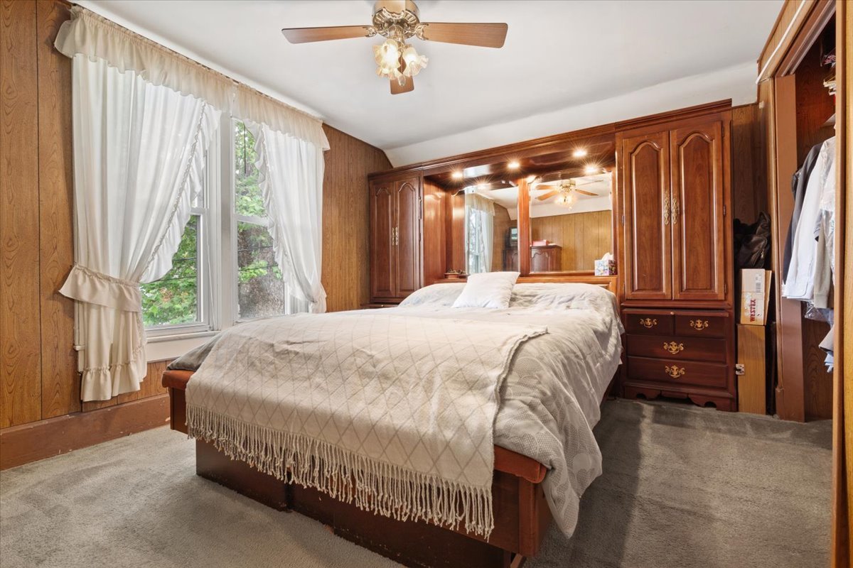 116 Spring Street Cary, IL 60013 - Photo 22 of 45 a bedroom with a large bed and a large window