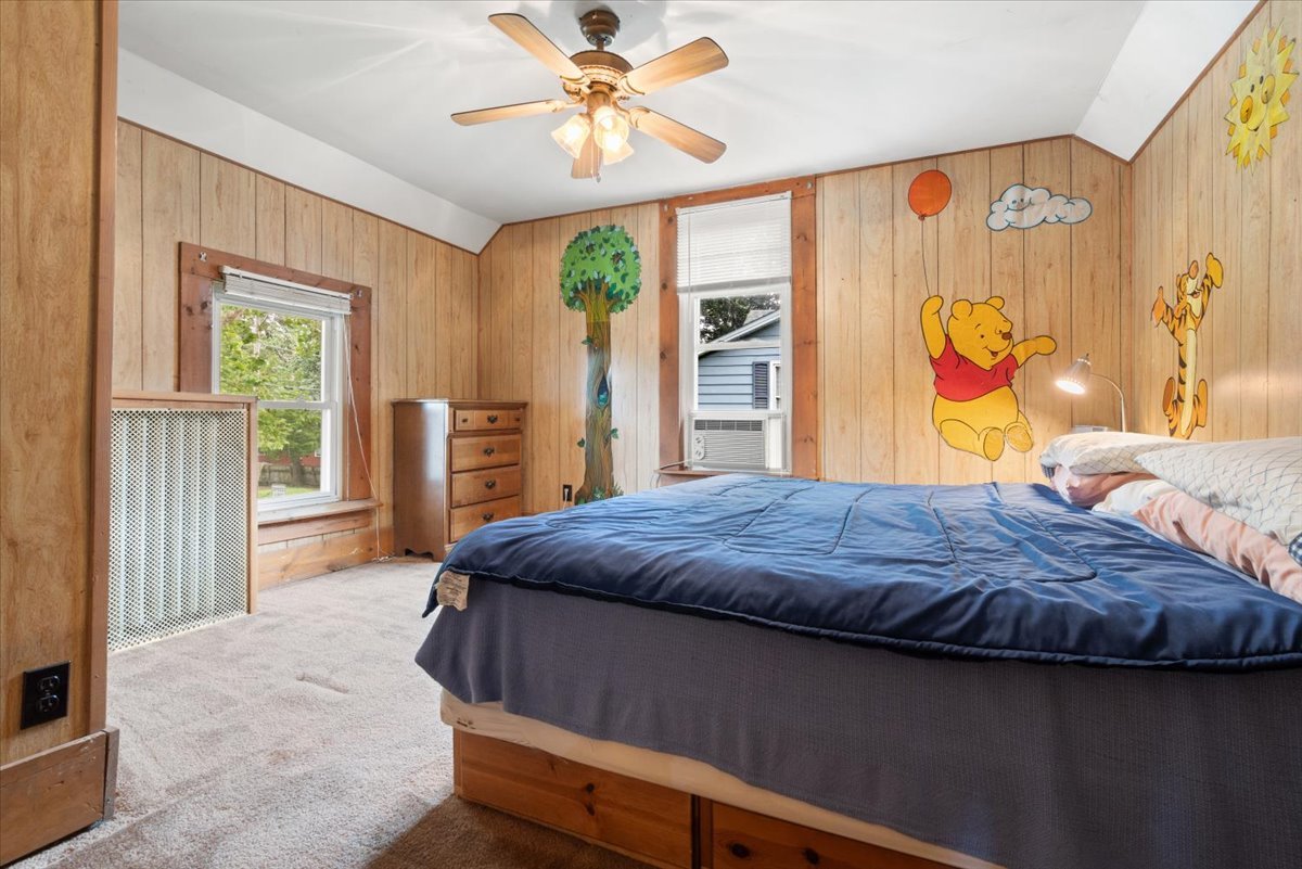 116 Spring Street Cary, IL 60013 - Photo 26 of 45 a bedroom with a bed dresser and a window