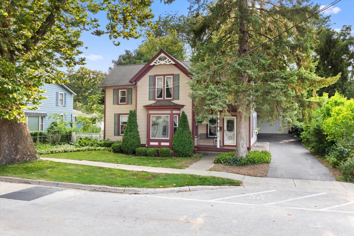 116 Spring Street Cary, IL 60013 - Photo 5 of 45 a front view of a house with a yard