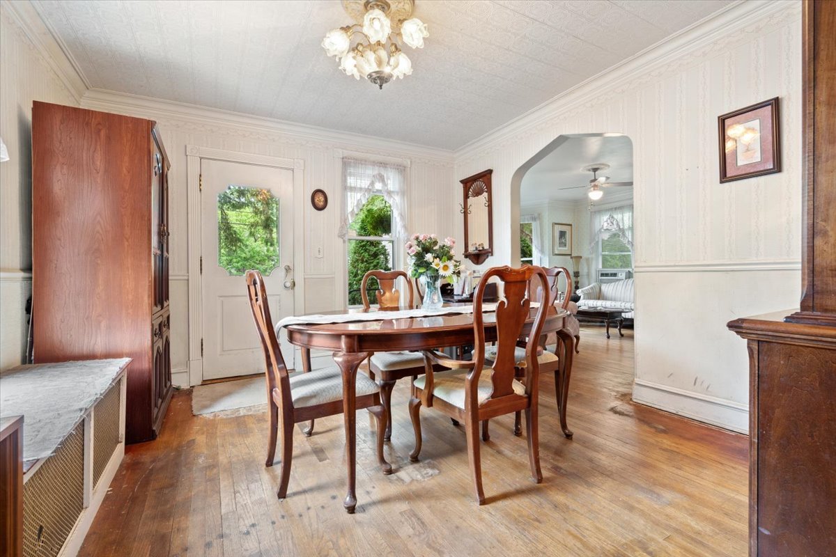 116 Spring Street Cary, IL 60013 - Photo 7 of 45 a view of a dining room with furniture window and wooden floor