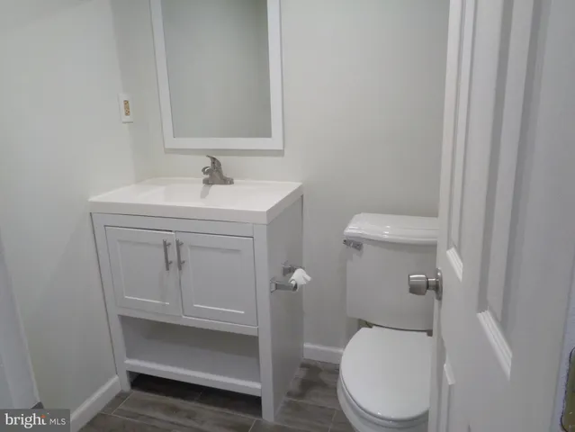 a bathroom with a sink and toilet