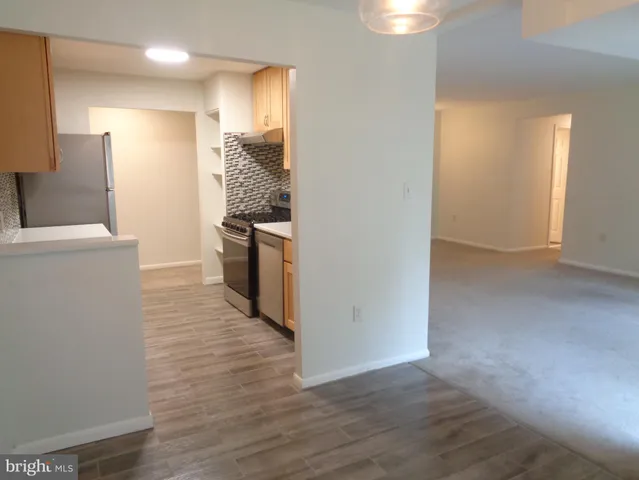 a view of a kitchen cabinets and wooden floor