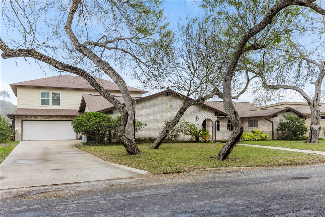 3350 Mavis Drive Corpus Christi, TX 78411 - Photo 1 of 40 a front view of a house with a yard