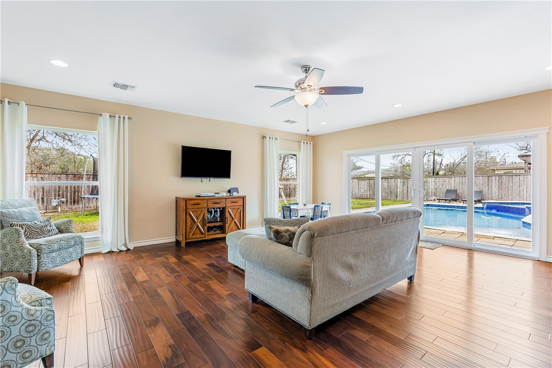 3350 Mavis Drive Corpus Christi, TX 78411 - Photo 15 of 40 a living room with fireplace furniture and a flat screen tv