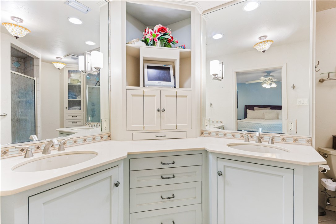 3350 Mavis Drive Corpus Christi, TX 78411 - Photo 21 of 40 a bathroom with a sink vanity and a mirror