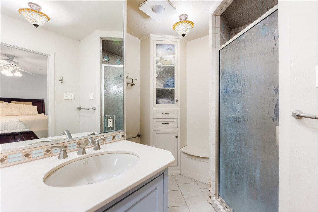 3350 Mavis Drive Corpus Christi, TX 78411 - Photo 22 of 40 a bathroom with a sink and a mirror