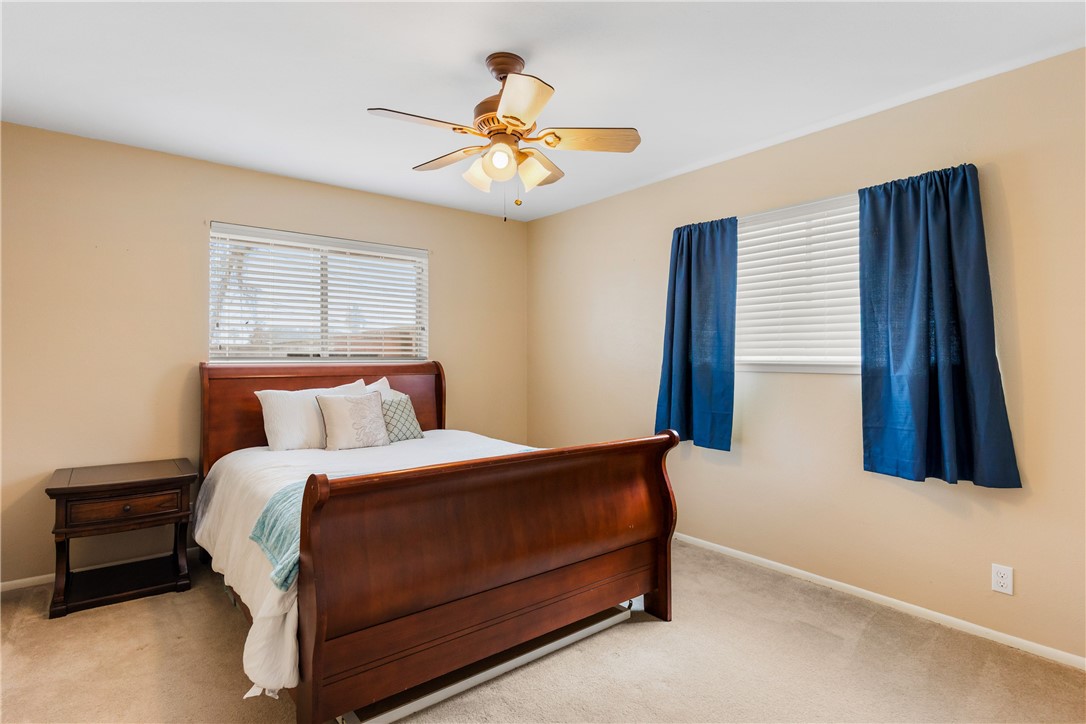 3350 Mavis Drive Corpus Christi, TX 78411 - Photo 27 of 40 a bedroom with a bed and a chandelier