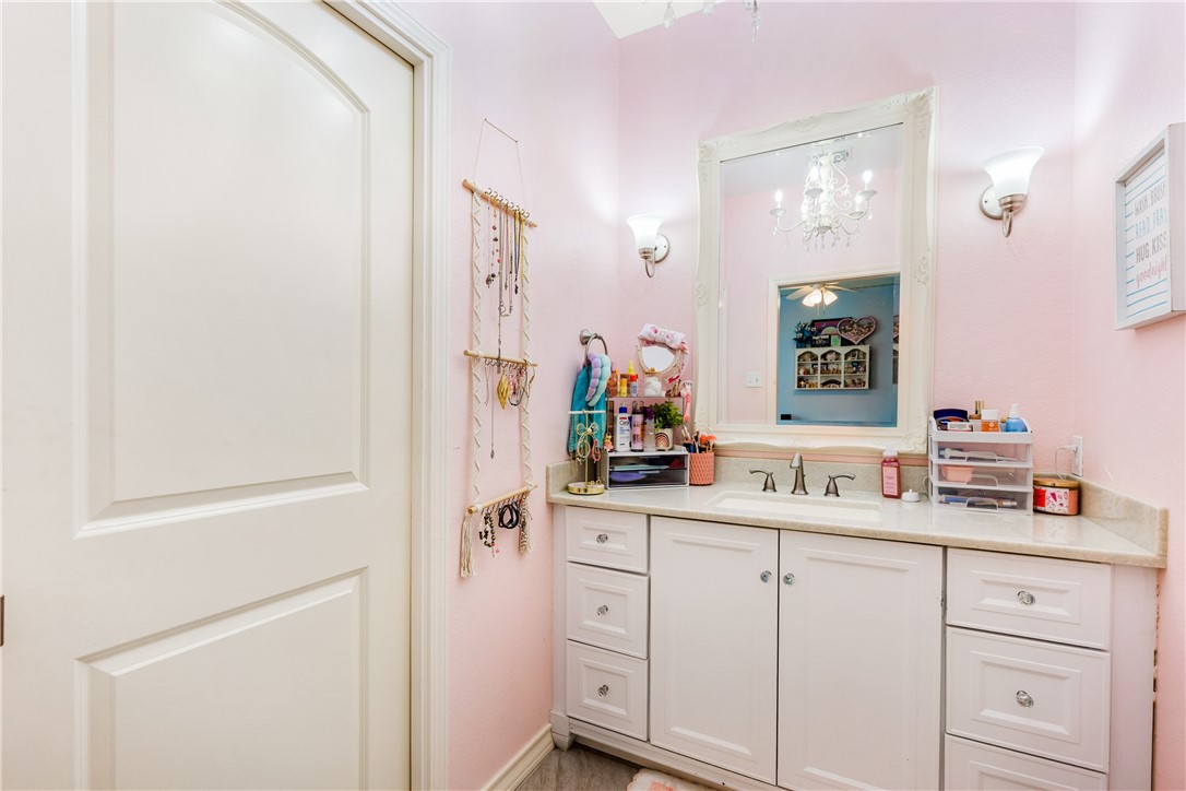 3350 Mavis Drive Corpus Christi, TX 78411 - Photo 32 of 40 a bathroom with a sink and a mirror