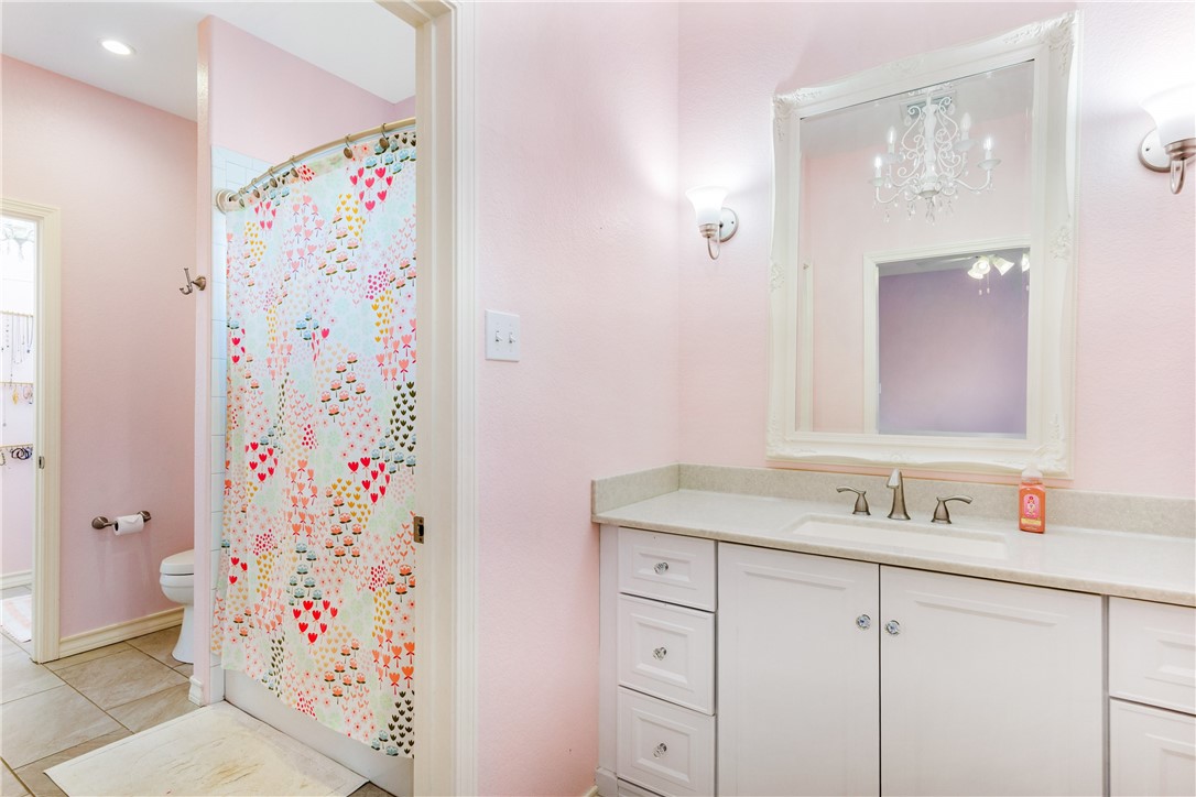 3350 Mavis Drive Corpus Christi, TX 78411 - Photo 33 of 40 a bathroom with a sink and a mirror