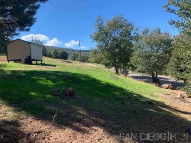 17461 Harrison Park Road Julian, CA 92036 - Photo 13 of 22 a backyard of a house with lots of green space