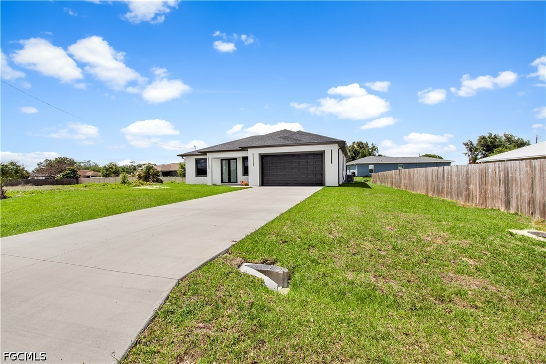 3004 South Tulip Road LaBelle, FL 33935 - Photo 3 of 24 a view of a house with a yard