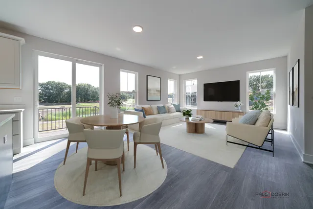 a view of a dining room with furniture window and wooden floor