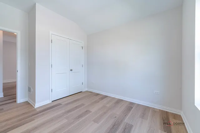 an empty room with wooden floor
