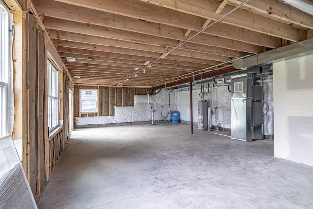 a view of empty room with wooden walls