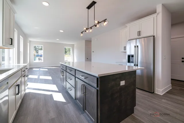 a kitchen with stainless steel appliances a sink and stove
