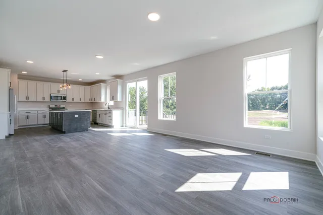a view of a kitchen with a stove cabinets and wooden floor