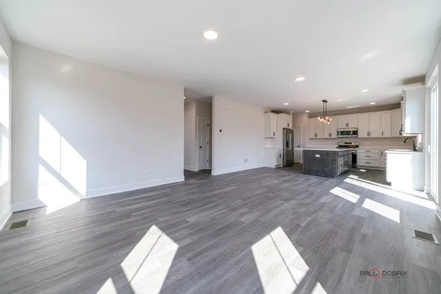 a view of kitchen and wooden floor