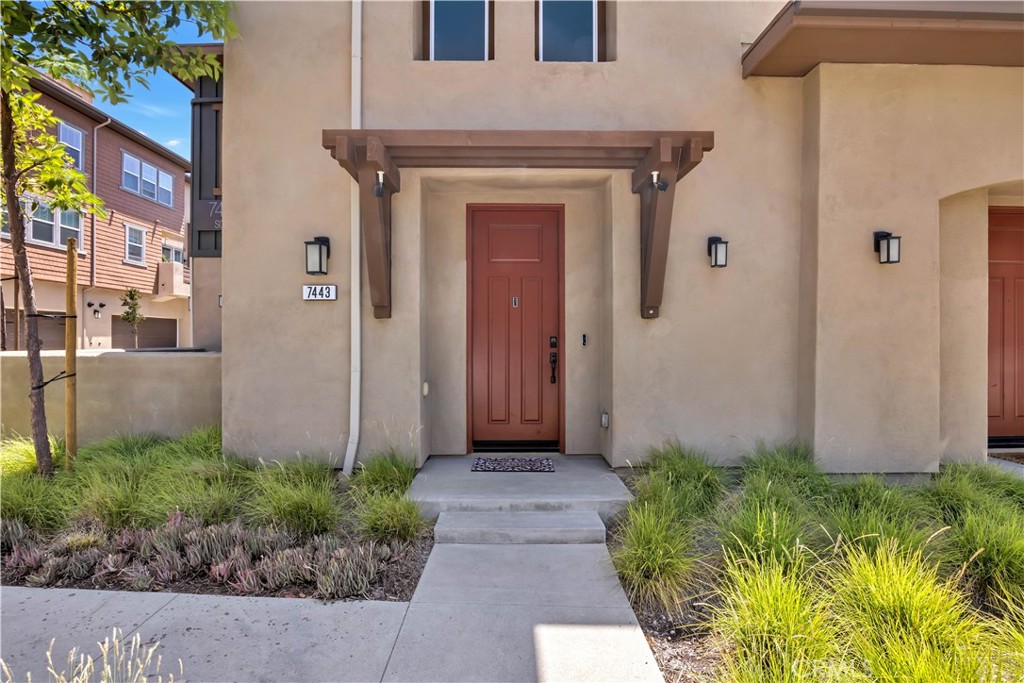 7443 Solstice Place Rancho Cucamonga, CA 91739 - Photo 1 of 1 a front view of a house with garden