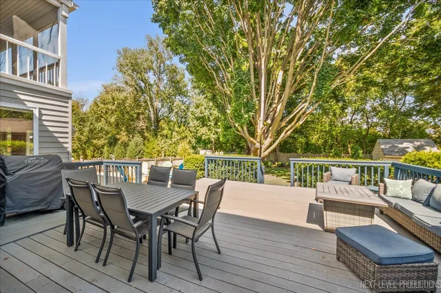a view of balcony with furniture and trees