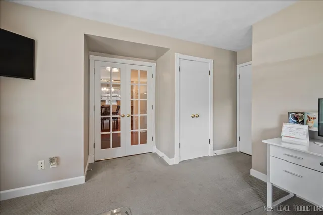 a view of a bedroom with workspace and a window