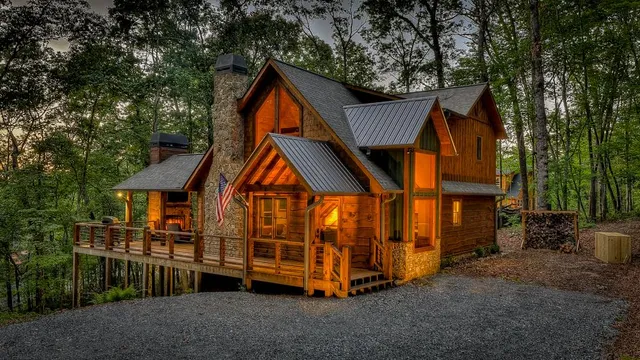 a view of house with a yard and deck