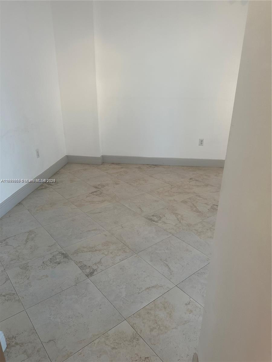 2400 Southwest 27th Avenue, Unit 406 Miami, FL 33145 - Photo 17 of 31 close up of a white marble wall