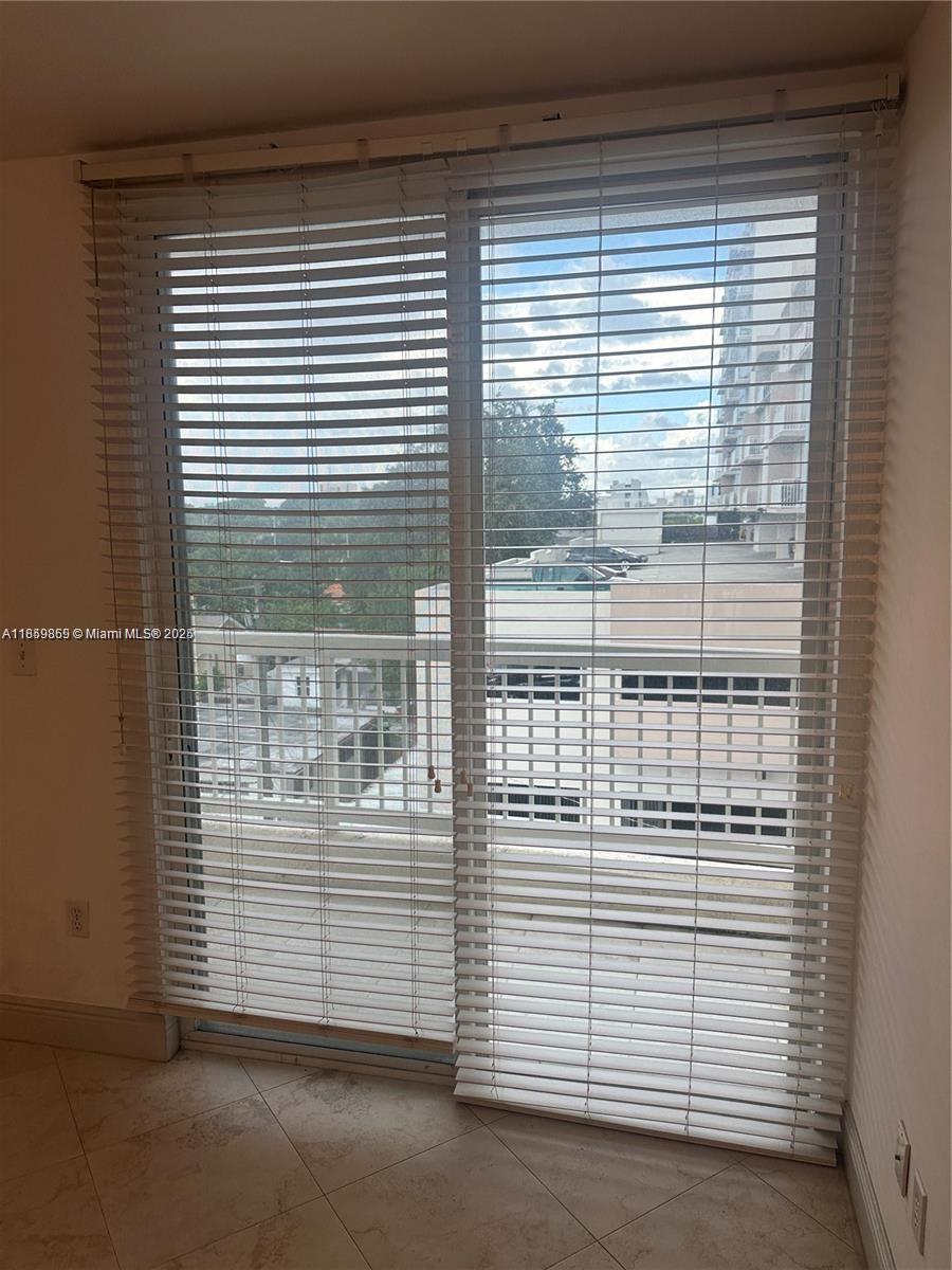 2400 Southwest 27th Avenue, Unit 406 Miami, FL 33145 - Photo 22 of 31 a view of a door and a window