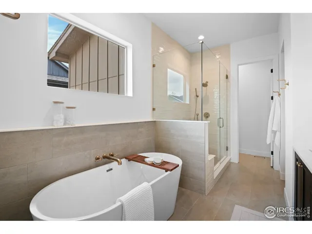 a bathroom with a bathtub and a sink