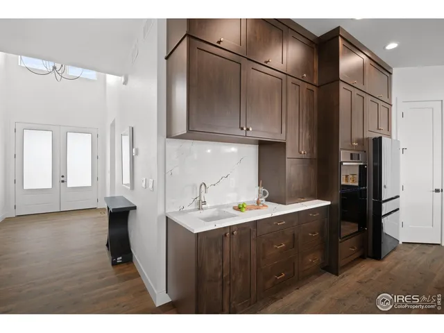 a kitchen with cabinets and stainless steel appliances