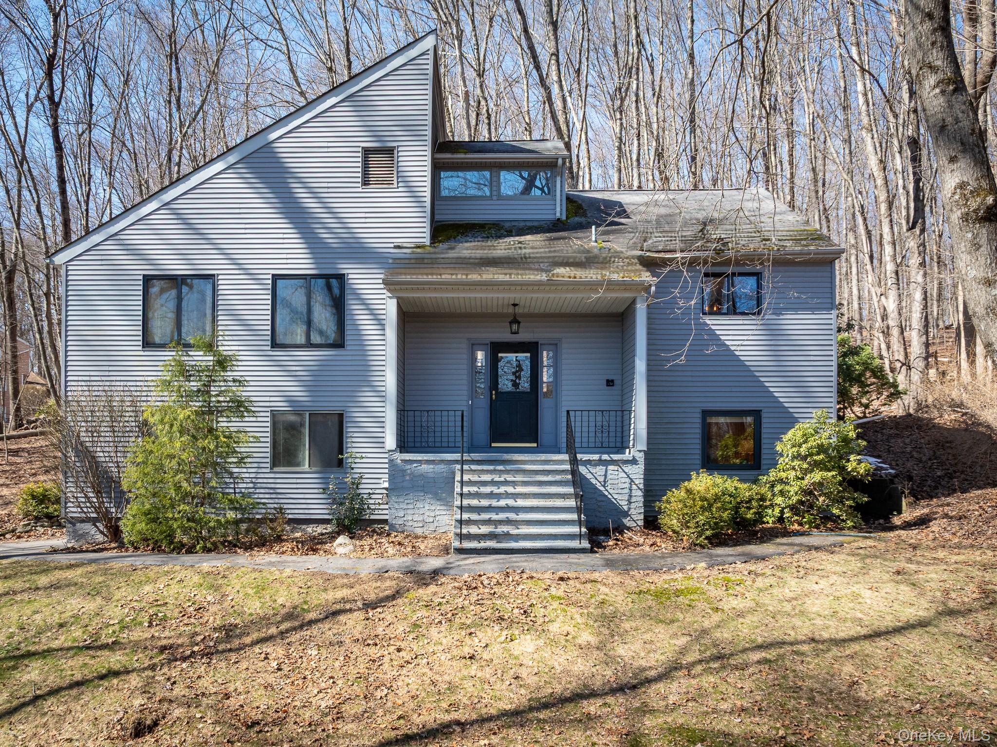 27 Mohawk Lane Baldwin Place, NY 10505 - Photo 1 of 38 a front view of a house with garden