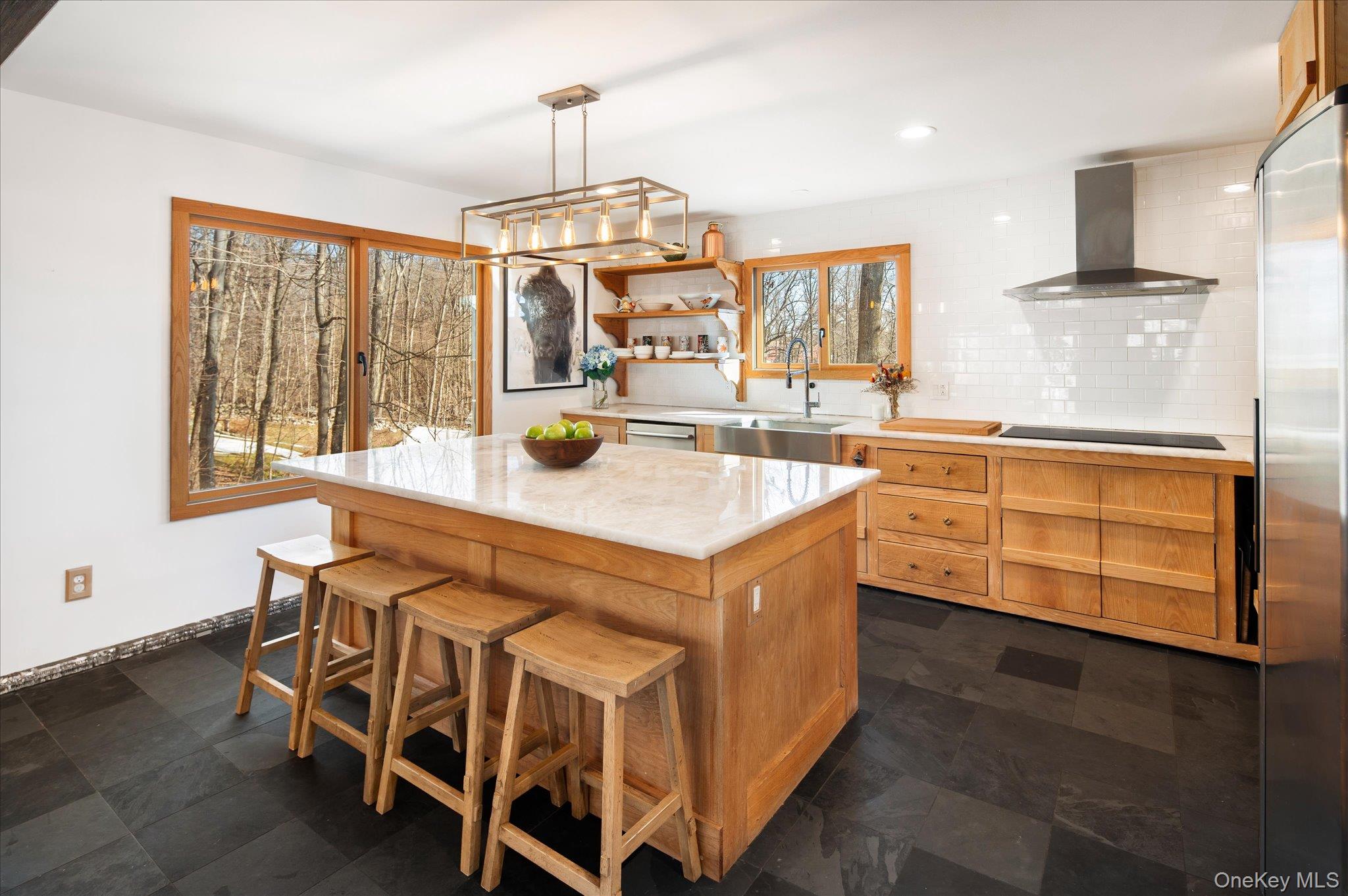 27 Mohawk Lane Baldwin Place, NY 10505 - Photo 15 of 38 a kitchen with stainless steel appliances a stove a sink dishwasher and cabinets with wooden floor