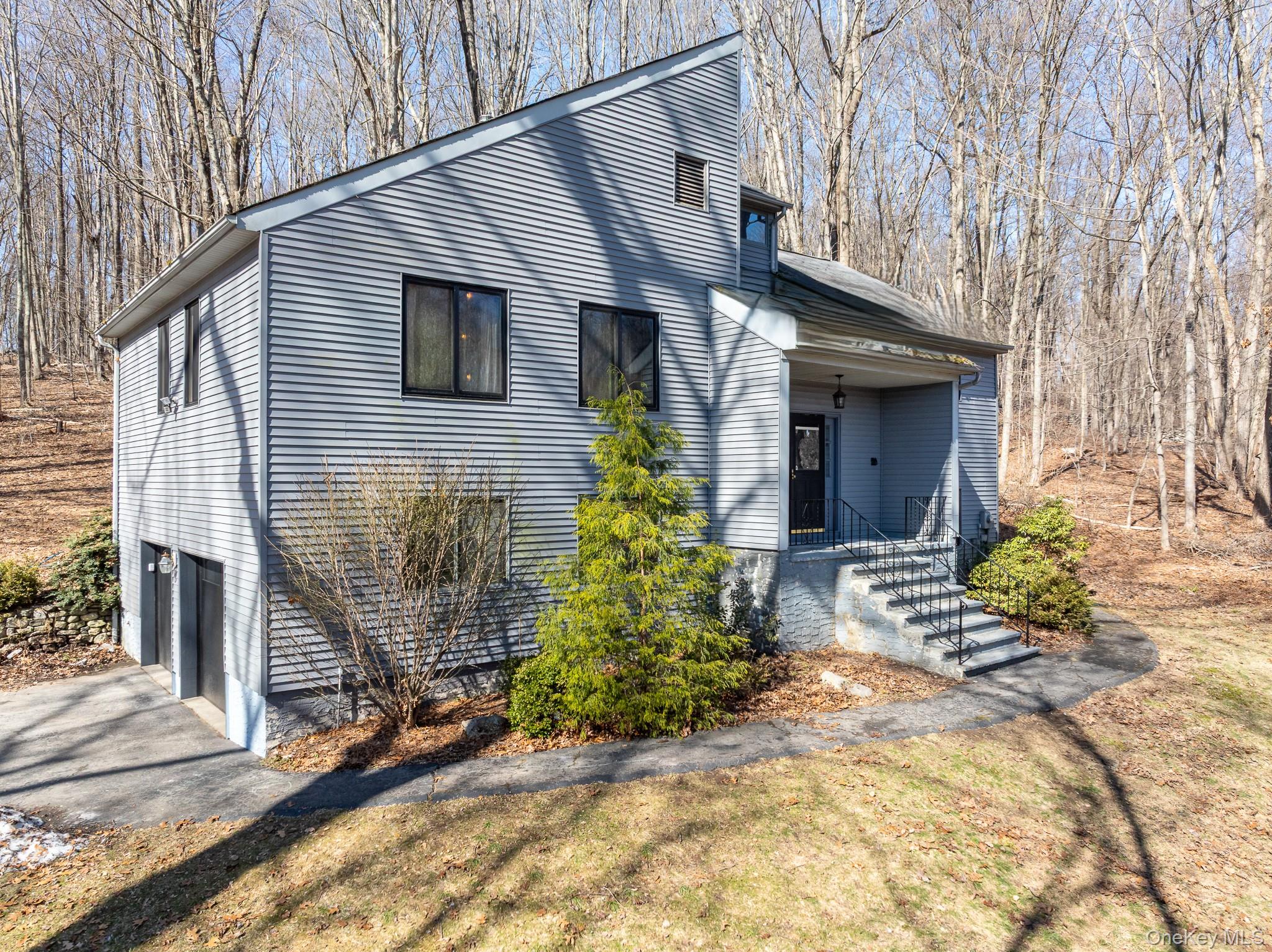 27 Mohawk Lane Baldwin Place, NY 10505 - Photo 2 of 38 a front view of a house with garden