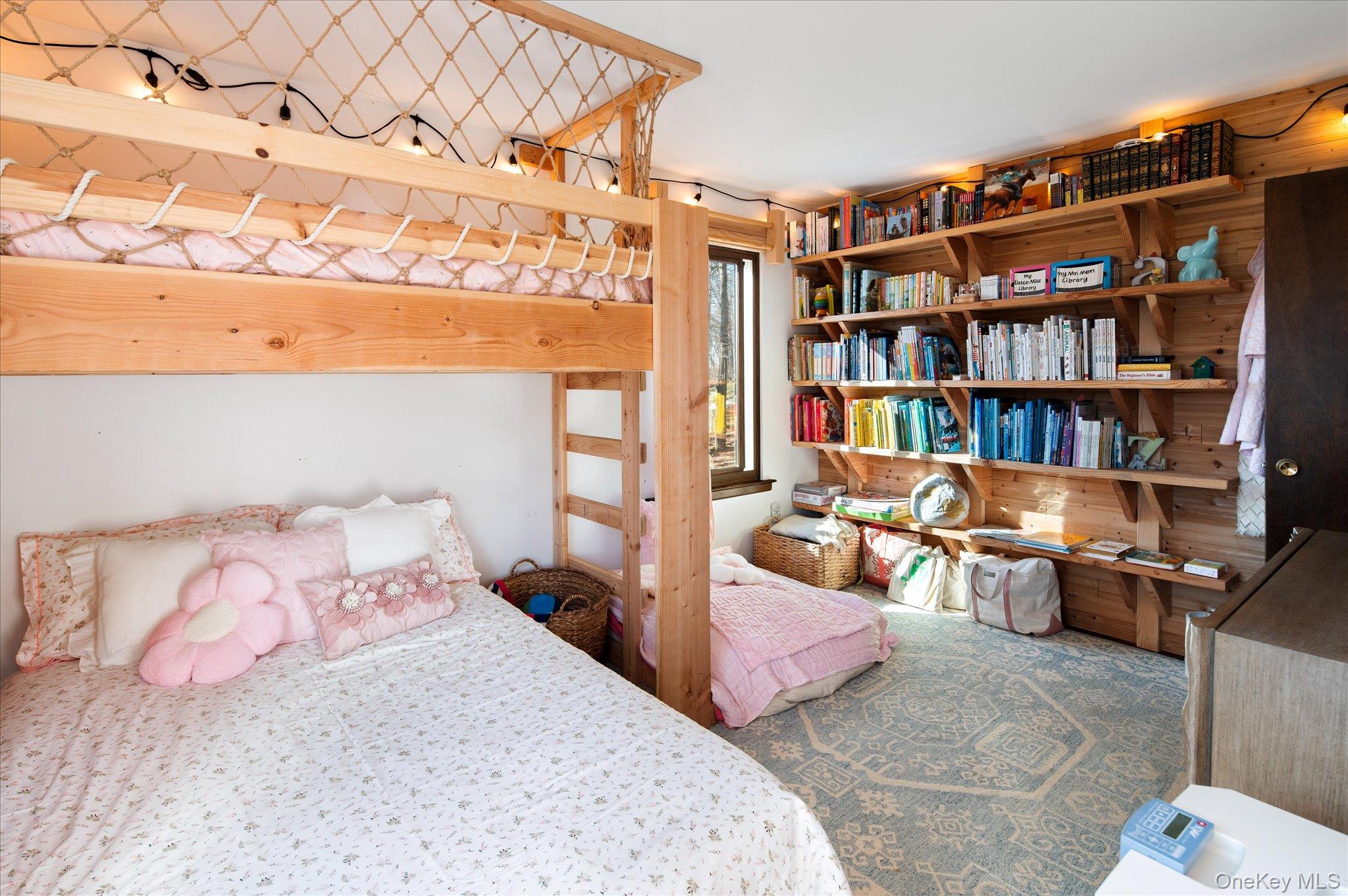 27 Mohawk Lane Baldwin Place, NY 10505 - Photo 21 of 38 a bedroom with a bed and a book shelf