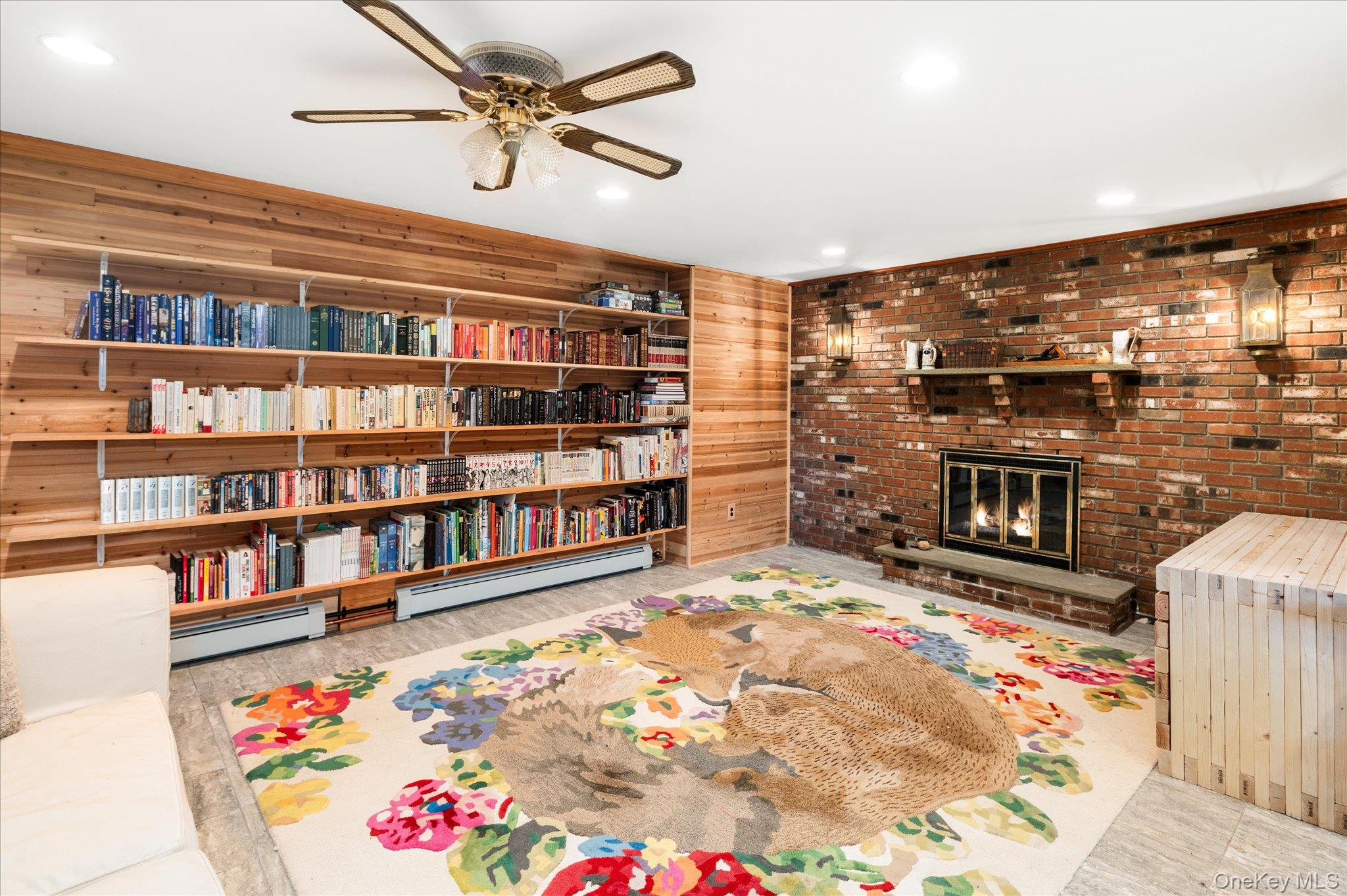 27 Mohawk Lane Baldwin Place, NY 10505 - Photo 26 of 38 a living room with fireplace furniture and a rug