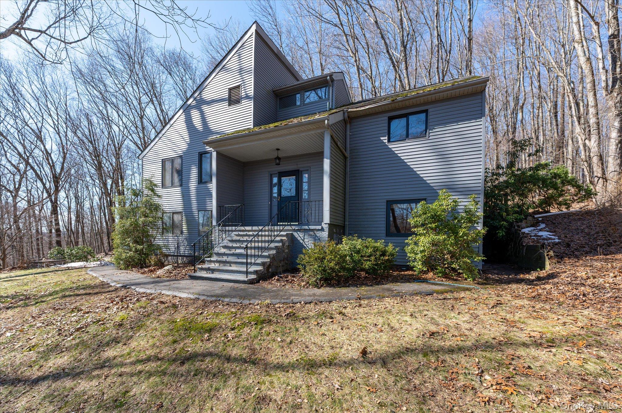 27 Mohawk Lane Baldwin Place, NY 10505 - Photo 37 of 38 a front view of a house with a yard