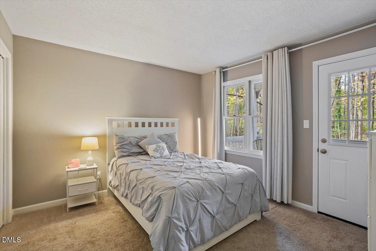 100 Hunting Chase, Unit 1D Cary, NC 27513 - Photo 15 of 29 a bedroom with a bed and a window