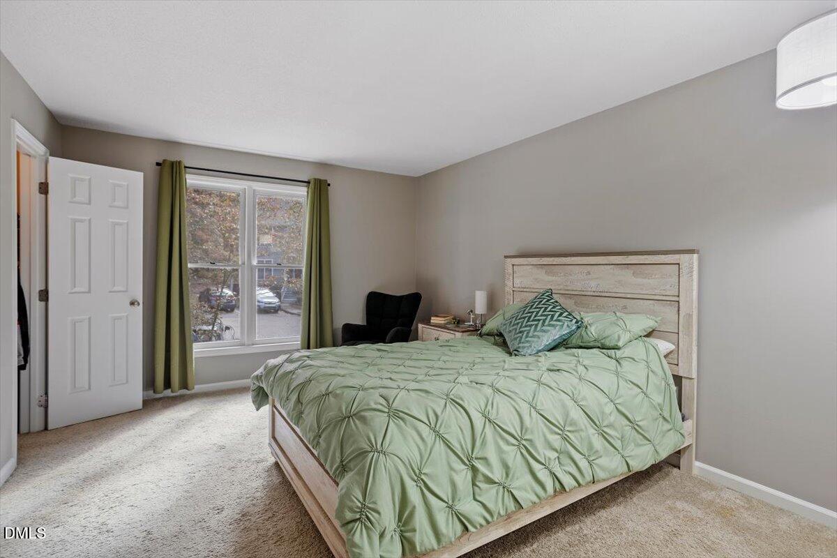 100 Hunting Chase, Unit 1D Cary, NC 27513 - Photo 22 of 29 a bedroom with a bed and a window