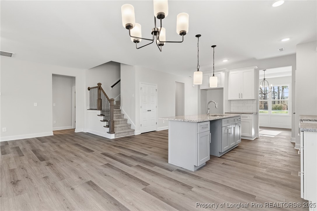 2202 Montrose (lot 3) Road Raeford, NC 28376 - Photo 13 of 44 a view of kitchen and hall with wooden floor